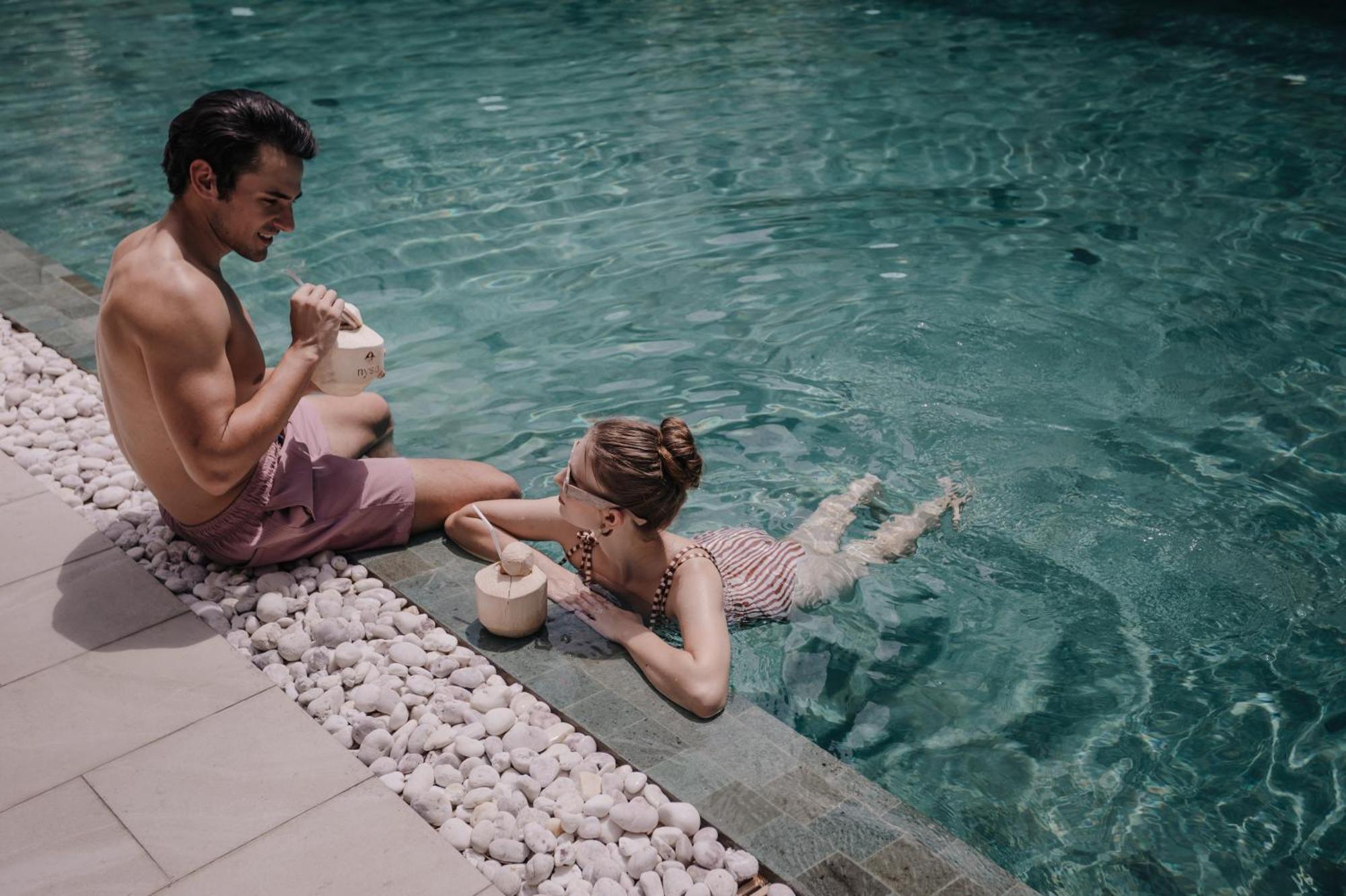 Nysa Hotel Bangkok Sukhumvit 11 Екстер'єр фото A couple drinking coconut water in a swimming pool